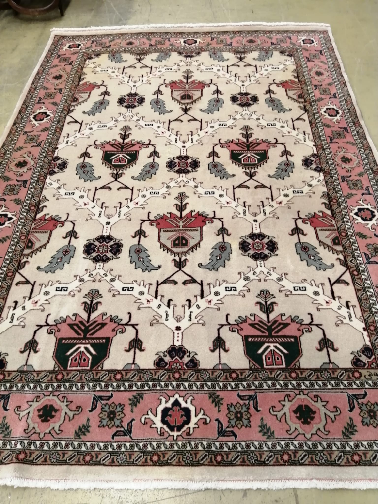 A Heriz ivory ground carpet - signed, 305 x 210cm